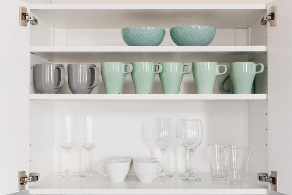 Cups and glasses stored on shelves