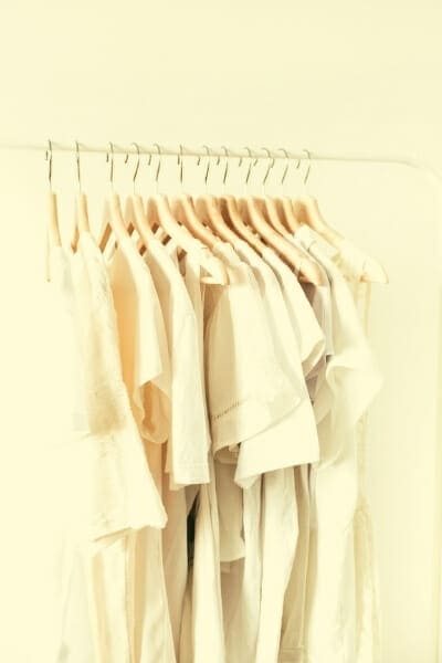 Clothes rack with all whites clothes on it
