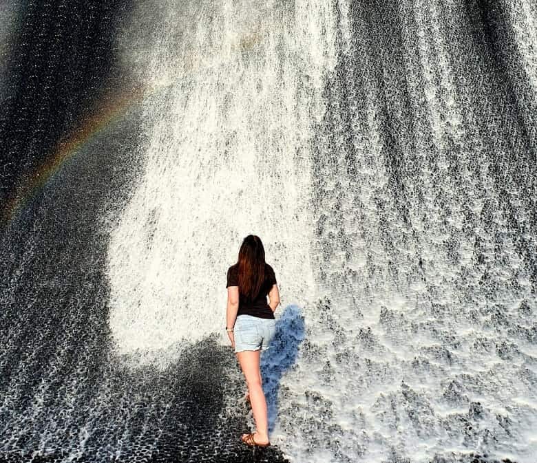 Behind-the-blogger-Picture-of-girl-standing-in-waterfall