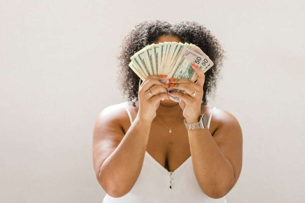 How to make life easier: woman holding money