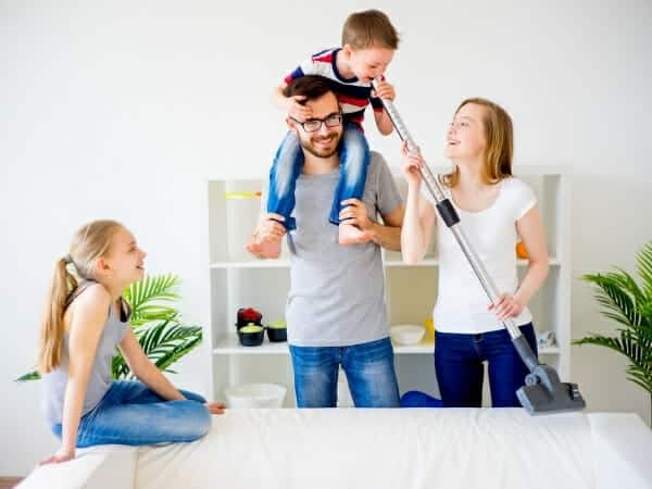 A list of household chores: Family having fun while cleaning